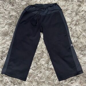 Lululemon women black drawstring waist band wide leg capri pants. Size S. Used.